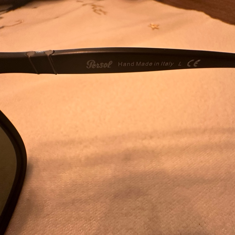 Persol sunglasses, sold with an off brand pouch and a prince case.